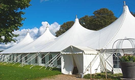 spacious blue portable restrooms organized at a fairground, allowing for comfortable use by individuals of all ages in Aromas